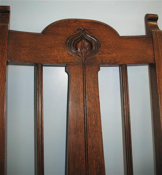 A pair of oak Art Nouveau elbow chairs